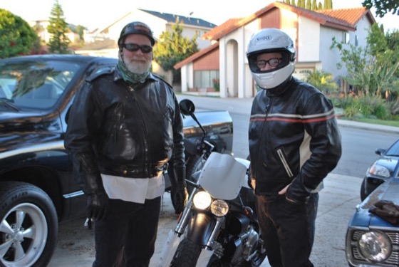 Jonathan and his dad standing by a silver 2007 Buell XB12STT on a Southern California street
