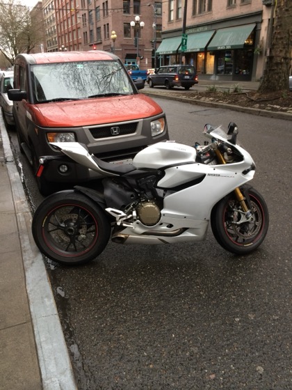 A white 2013 Ducati 1199 S parked in Pioneer Square, Seattle