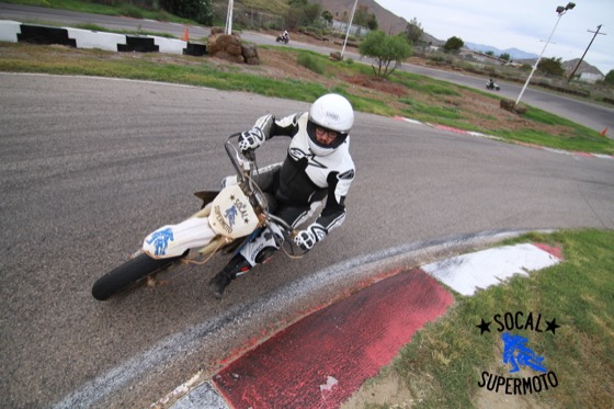 Jonathan riding a supermoto bike at Adams Kart Track