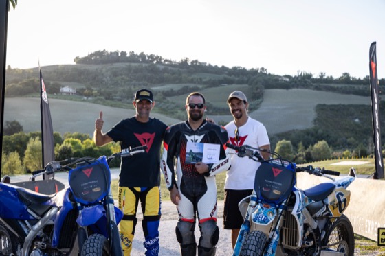 Jonathan with instructors and flat track bikes in the hills at Valentino Rossi's Motor Ranch in Italy