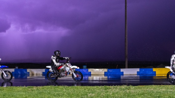 Jonathan Spiva on the #711 on a wet track under a purple storm sky (photo 67 of 77)