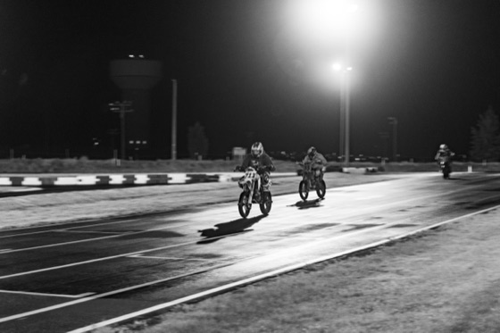 Black and white: the #711 leading a rider down the straight at night (photo 70 of 77)