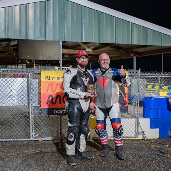 Jonathan Spiva and Matt Higgins with the third place plaque under the pit canopy (photo 77 of 77)