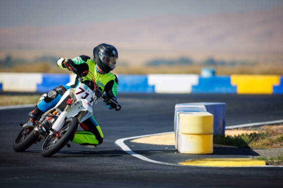 Jonathan Spiva leaning the Honda CRF150R #711 through a corner (photo 6 of 117)