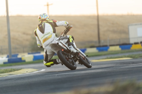 Garrick Fulbright leaning the #711 through a corner in the morning sun (photo 101 of 117)