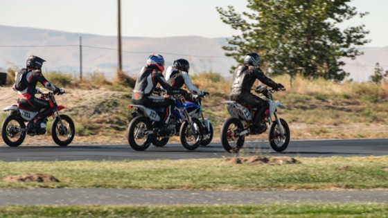 The #711 in a group of riders on the far side of the track (photo 18 of 117)