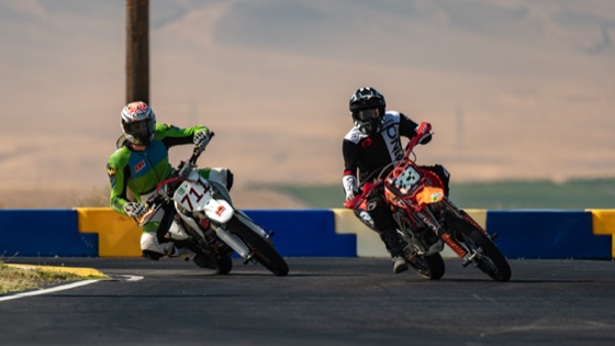 John Gessner on the #711 and a red bike leaned over side by side (photo 23 of 117)