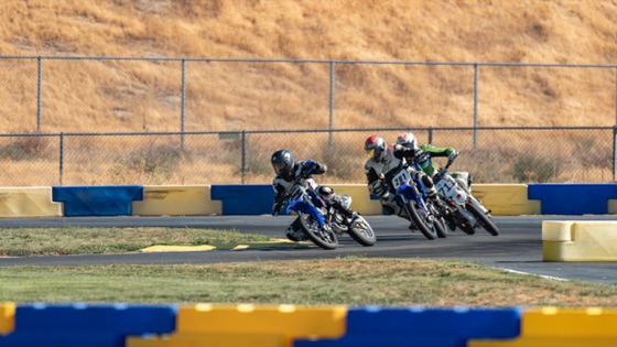 Riders through a corner below the dry hillside (photo 28 of 117)