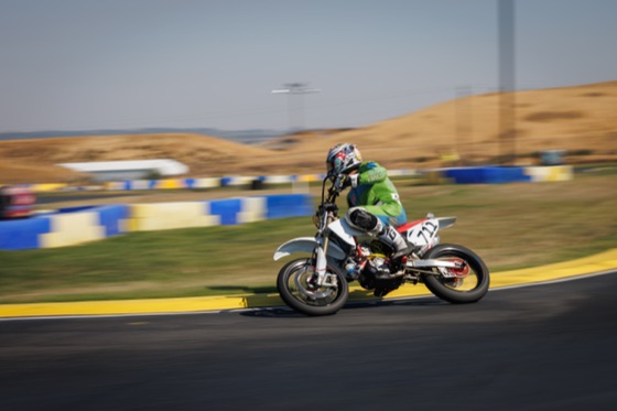 John Gessner cornering the #711 in front of the hills in the afternoon (photo 30 of 117)