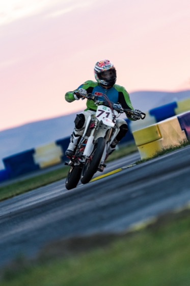Jonathan Spiva (#711) with the front wheel light at dusk