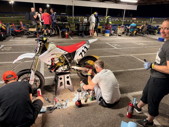 The Spiva Racing Team working on the #711 in the pits at night
