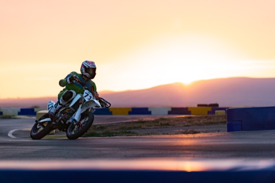 John Gessner leaned over on the #711 with the sun dropping behind the hills (photo 59 of 117)