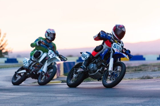 John Gessner on the #711 side by side with a blue bike at sunset (photo 60 of 117)