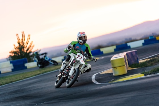 John Gessner leaned over on the #711 past the barriers at sunset (photo 62 of 117)