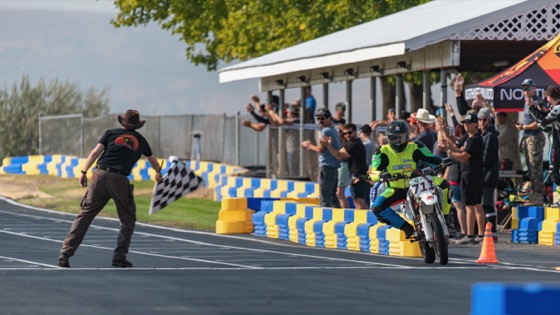 Jonathan Spiva (#711) taking the checkered flag