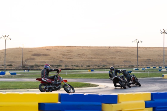 Riders through a corner in the early morning, the #711 among them (photo 78 of 117)