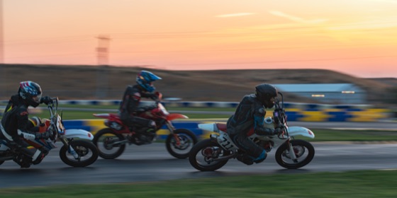 Hannah Johnson on the #711 ahead of the #15 and a red bike at sunrise (photo 88 of 117)