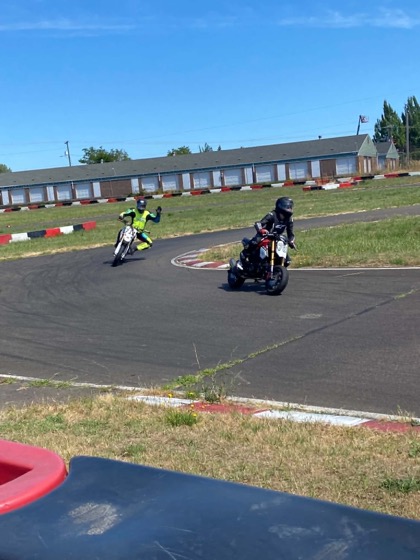 Jonathan following his niece on track at Mac Track and waving to the camera