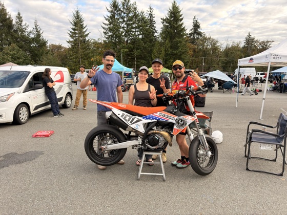 Spiva Racing with the #101 KTM 450 SMR after the finish, all four riders holding up three fingers