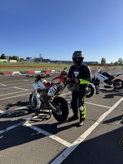 Jonathan Spiva (#711) in the Mac Track paddock with the Honda CRF150R and the Ducati Desmo450 (photo 2 of 7)