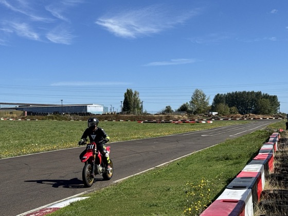 Jonathan Spiva (#711) riding the Ducati Desmo450 down the straight at Mac Track (photo 4 of 7)