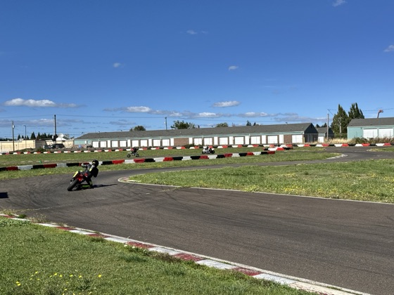 Jonathan Spiva (#711) leaning the Ducati Desmo450 through a left-hand corner at Mac Track (photo 5 of 7)
