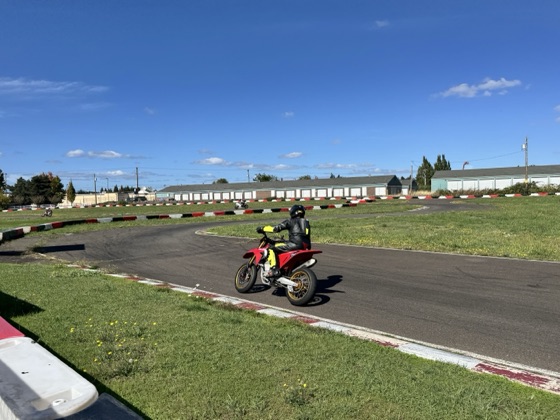 Jonathan Spiva (#711) riding the Ducati Desmo450 out of a corner at Mac Track (photo 7 of 7)