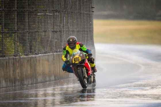 Jonathan Spiva (#916) racing in the rain at PIR