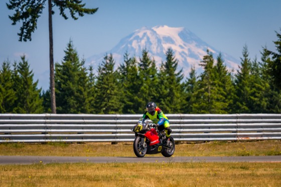 Jonathan Spiva (#916) on the Ducati Panigale R at The Ridge with Mount Rainier behind