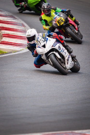 Jonathan Spiva (#916) running behind Jacob Marshall (#15X) through a corner at Portland International Raceway