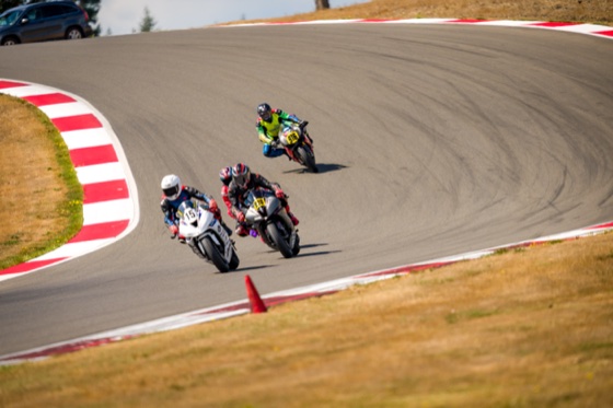 Jonathan Spiva (#916) running behind Jacob Marshall (#15), Steve Schock (#930) and Eric Lin (#997) into Turn 8a on the first lap at The Ridge Motorsports Park