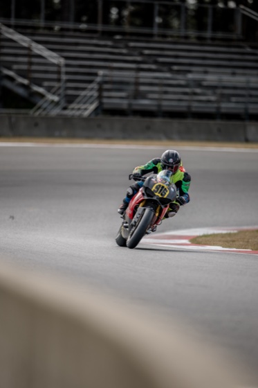 Jonathan Spiva (#916) driving the Ducati Panigale R out of Turn 15 with the front wheel light at The Ridge Motorsports Park