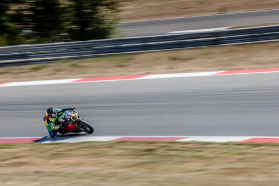 Jonathan Spiva (#916) with his knee over the curb on the Ducati Panigale R at The Ridge Motorsports Park