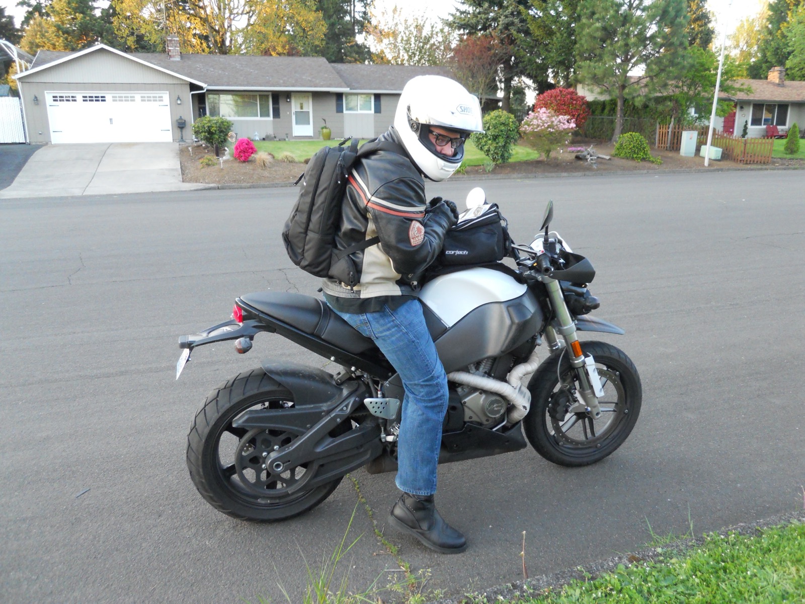Jonathan on the silver 2007 Buell XB12STT in front of a house in Vancouver, Washington