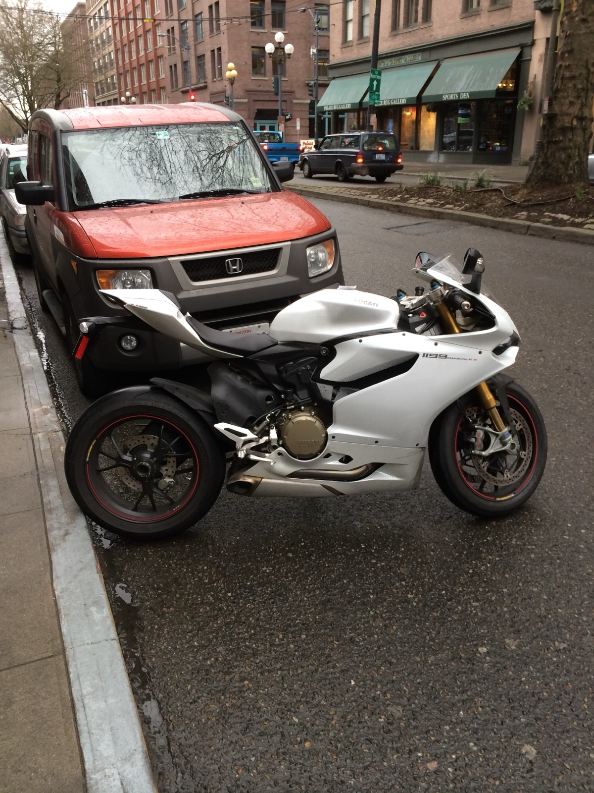 A white 2013 Ducati 1199 S parked in Pioneer Square, Seattle