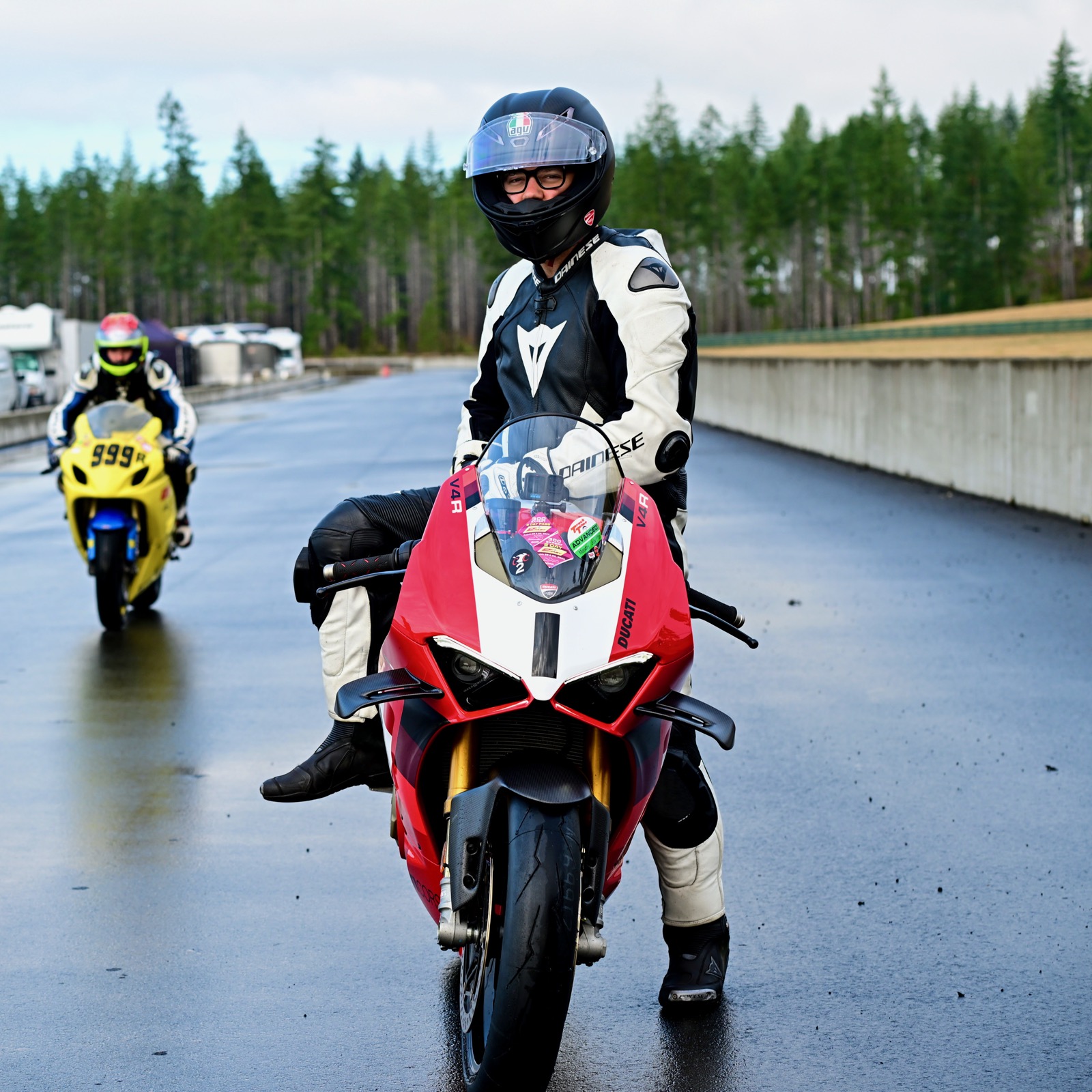 Jonathan on the Ducati Panigale on a wet track, another rider waiting behind