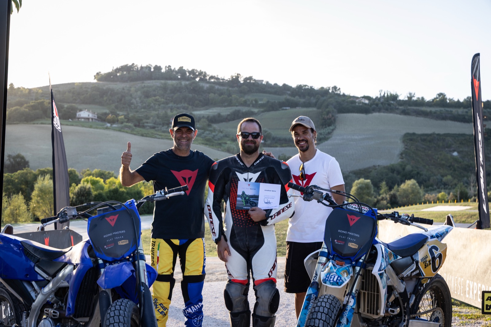 Jonathan with instructors and flat track bikes in the hills at Valentino Rossi's Motor Ranch in Italy