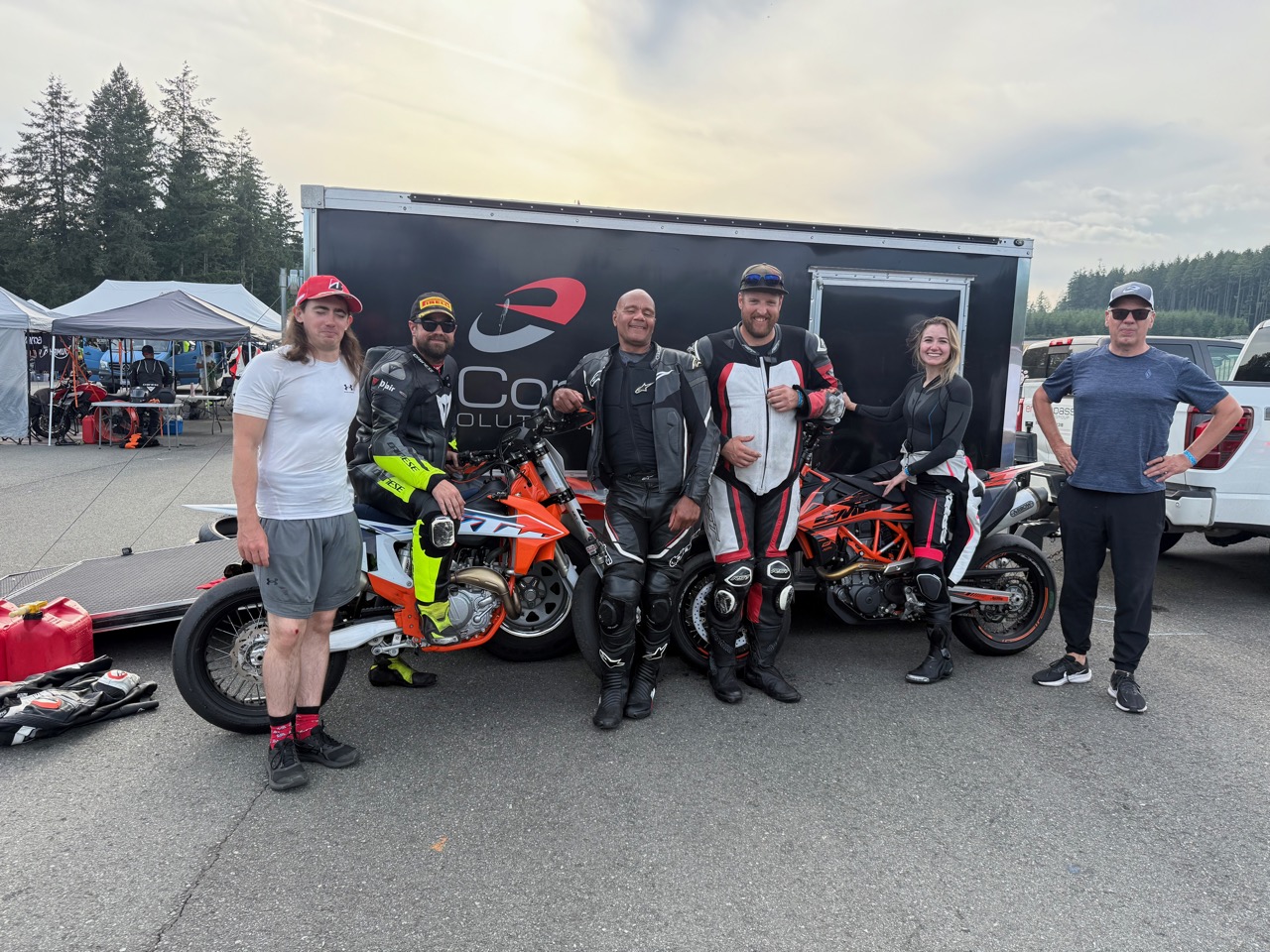 The enCompass B Team with the KTM 450 SMR in front of the team trailer