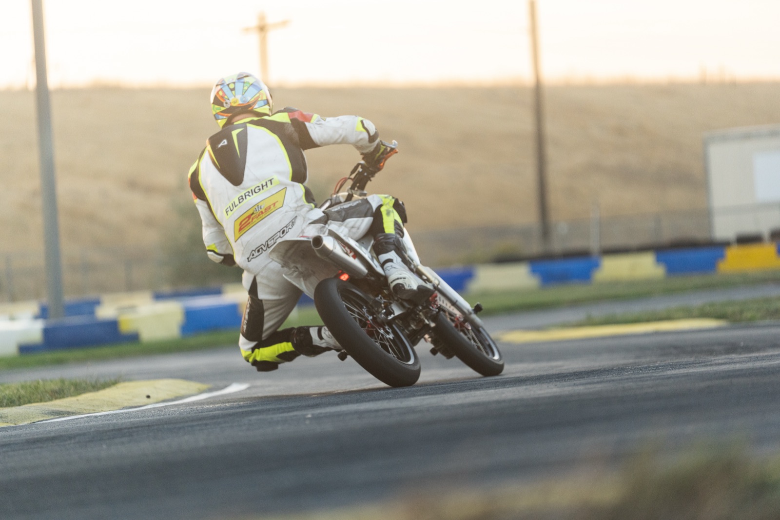 Garrick Fulbright leaning the #711 through a corner in the morning sun (photo 101 of 117)