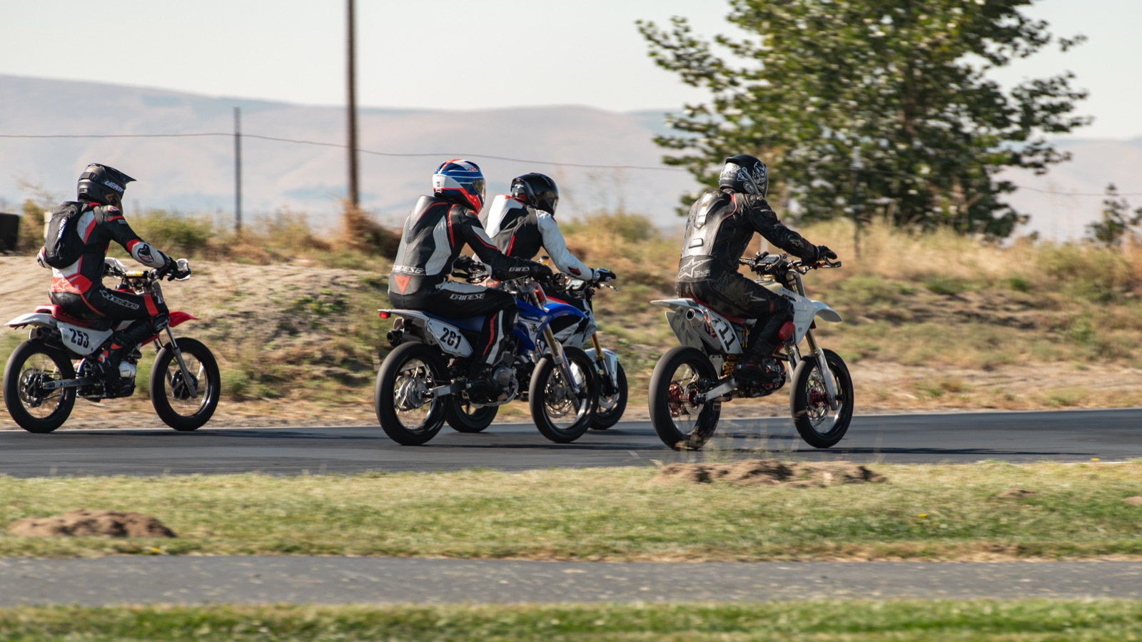 The #711 in a group of riders on the far side of the track (photo 18 of 117)