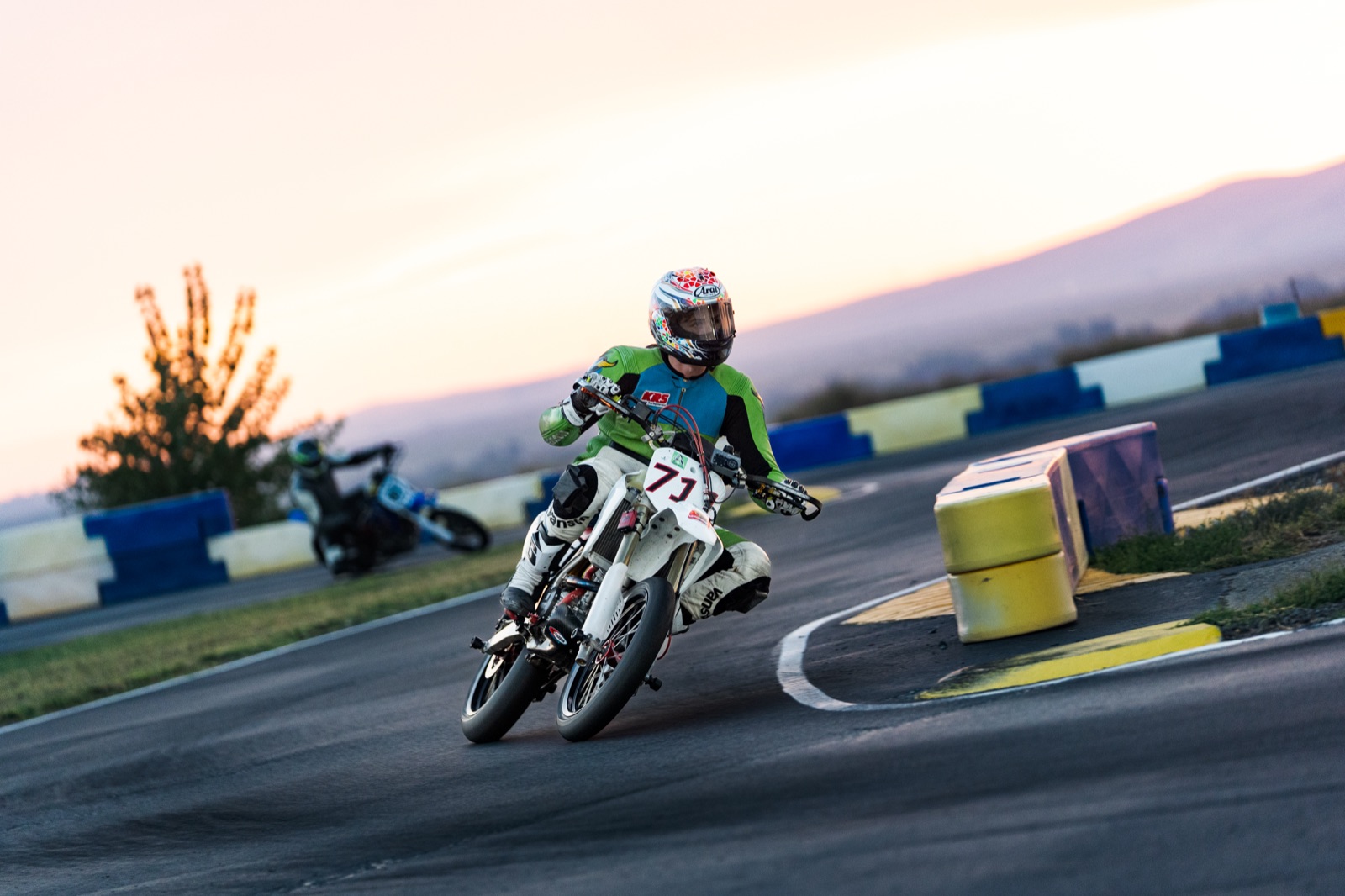 John Gessner leaned over on the #711 past the barriers at sunset (photo 62 of 117)