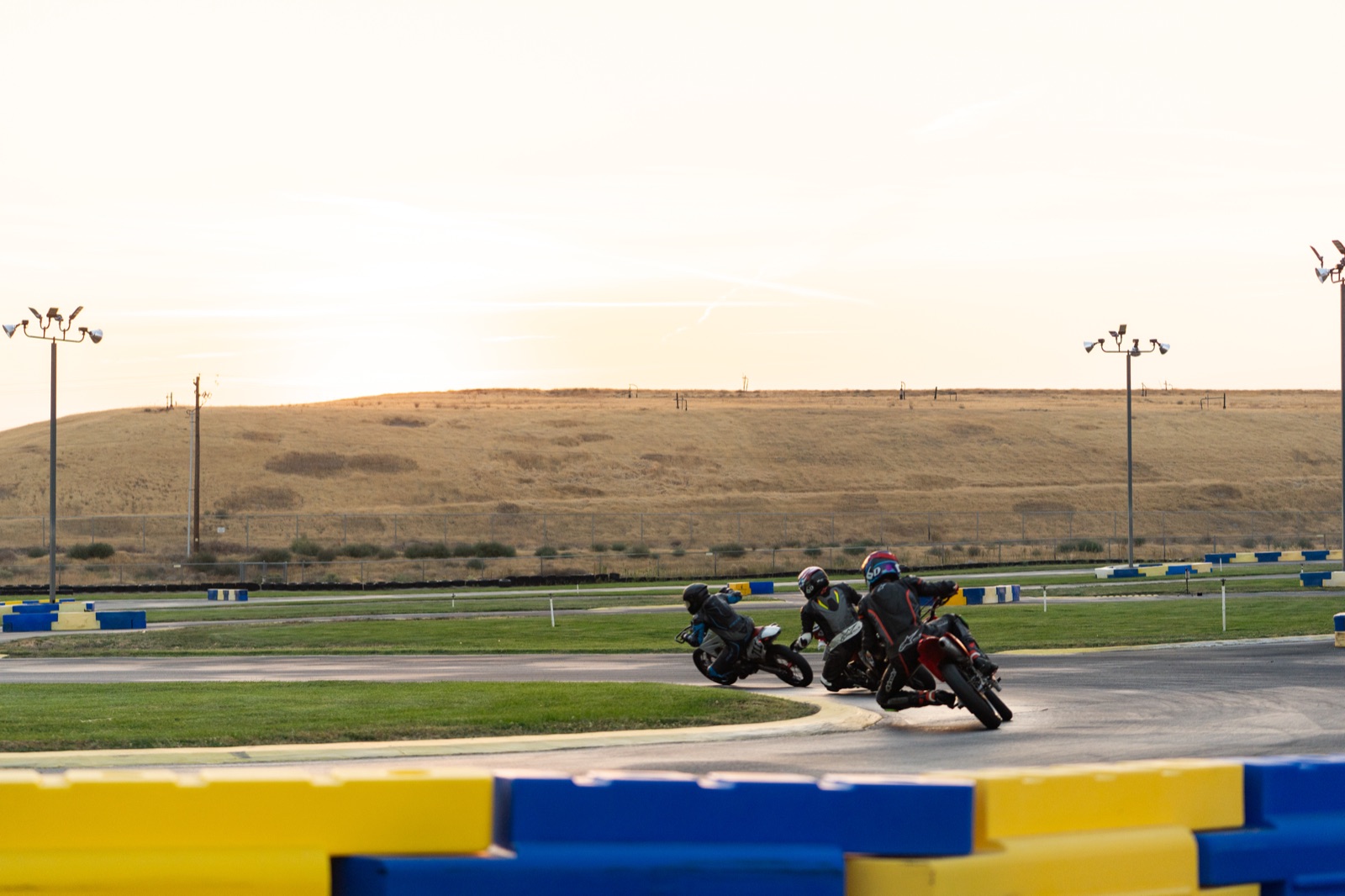 Riders through a far corner in the early morning light (photo 79 of 117)