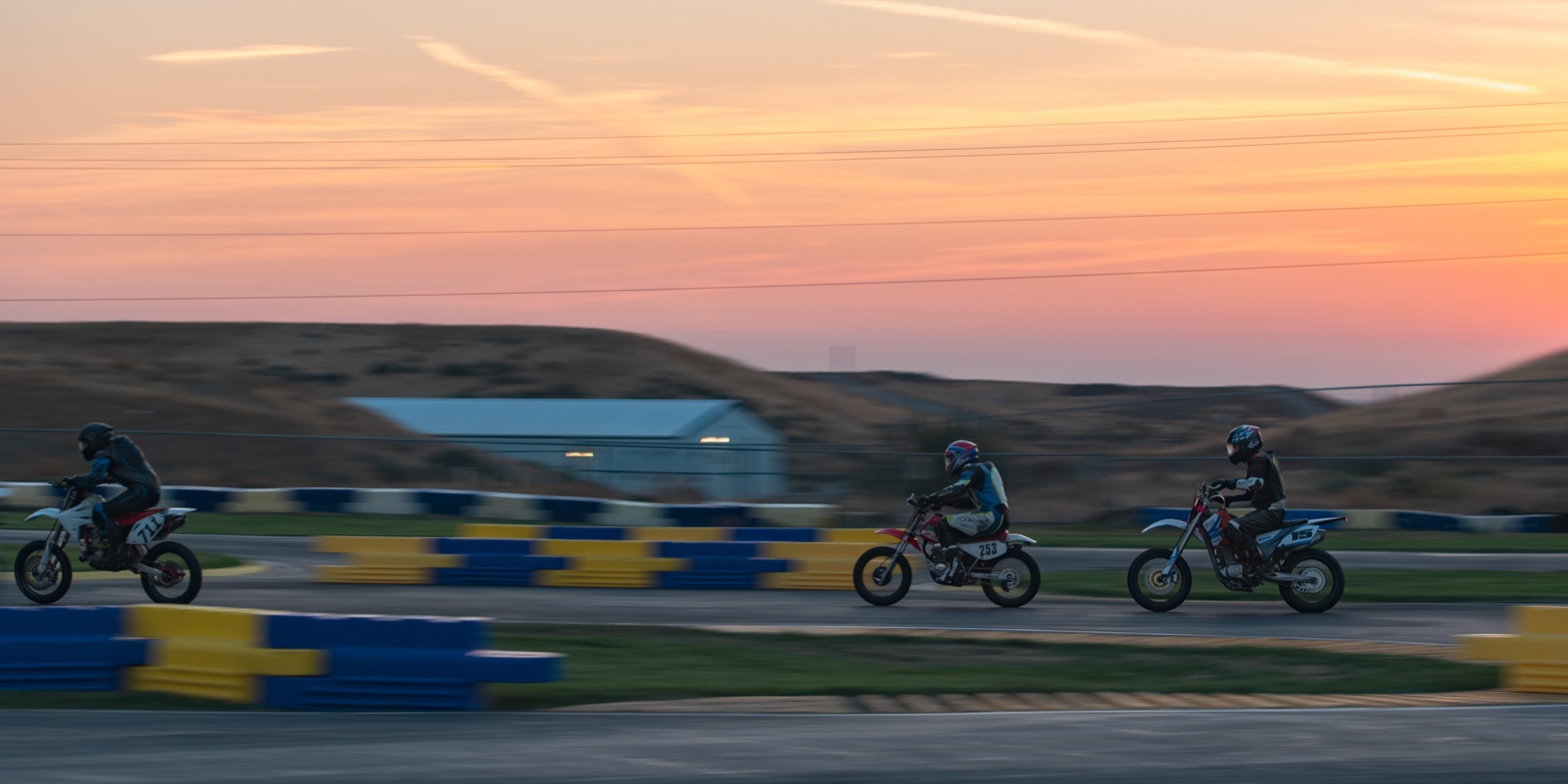 Riders spread along the track at sunrise (photo 85 of 117)