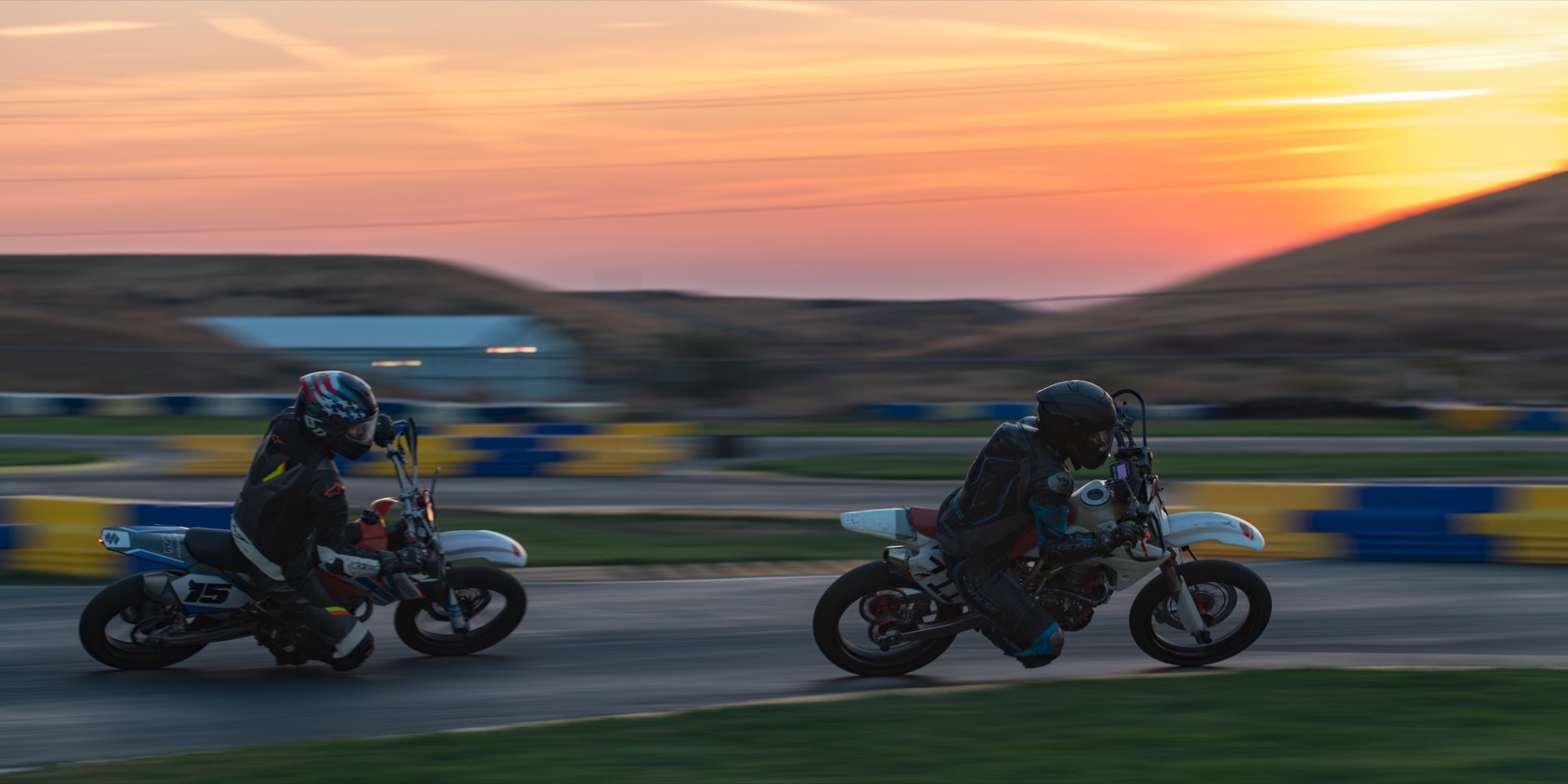 Hannah Johnson on the #711 and the #15 panning past the barriers at sunrise (photo 87 of 117)