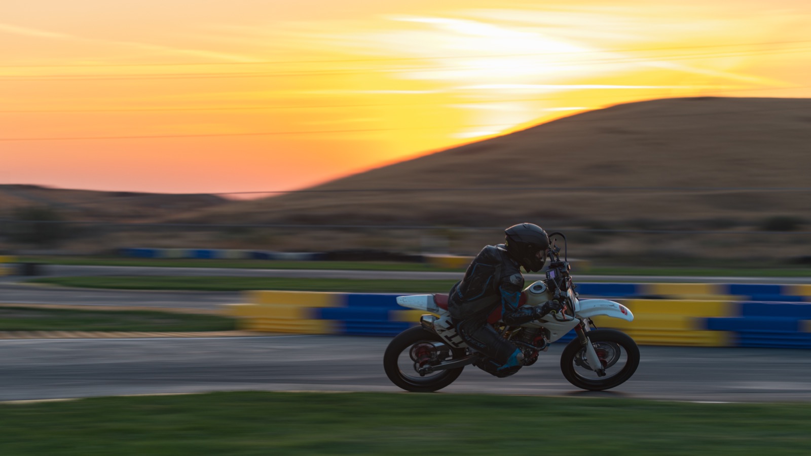 Hannah Johnson on the #711 alone against a yellow sunrise (photo 98 of 117)