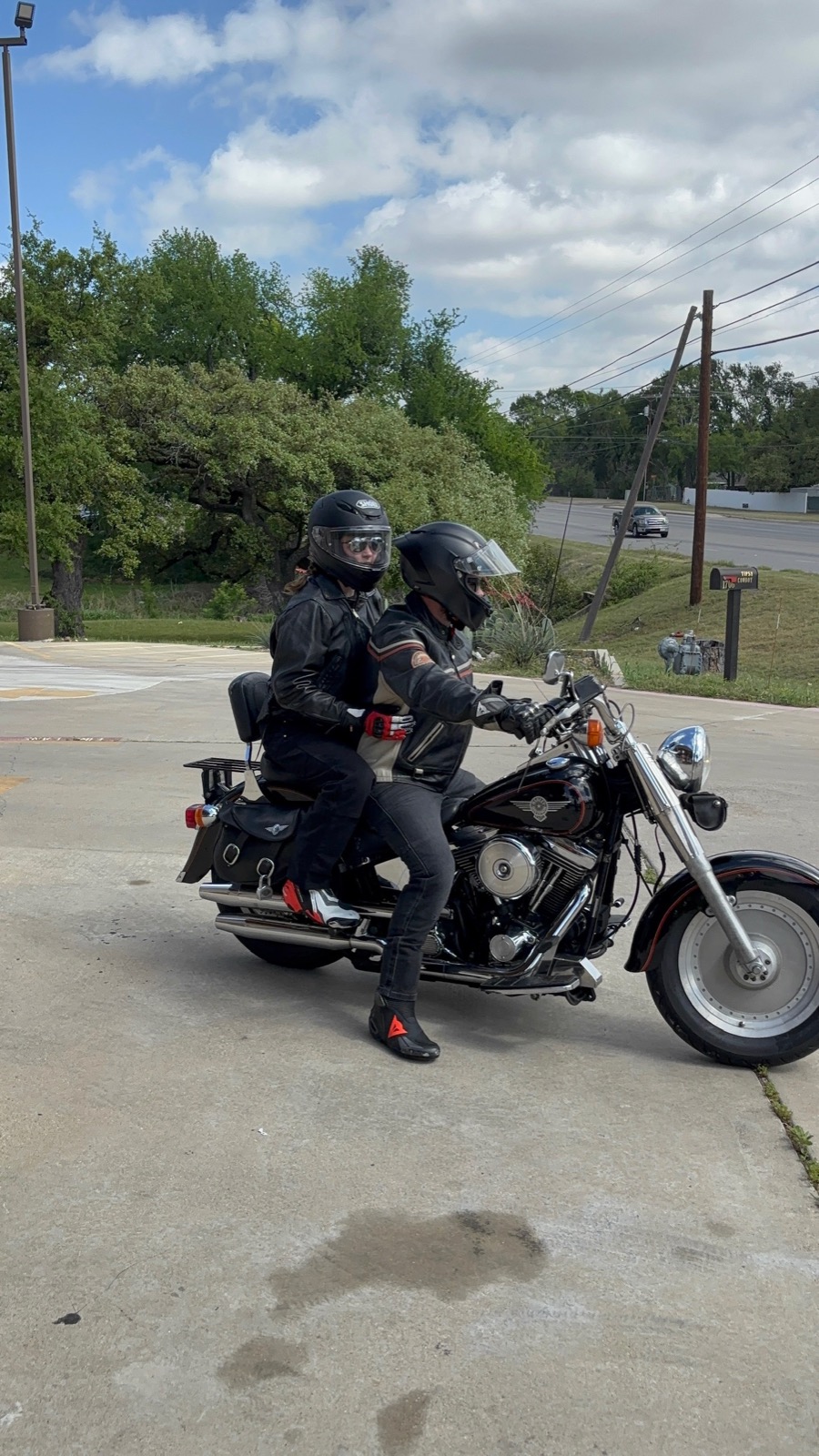 Jonathan taking his niece for a ride on his dad's 1992 Harley-Davidson Fat Boy