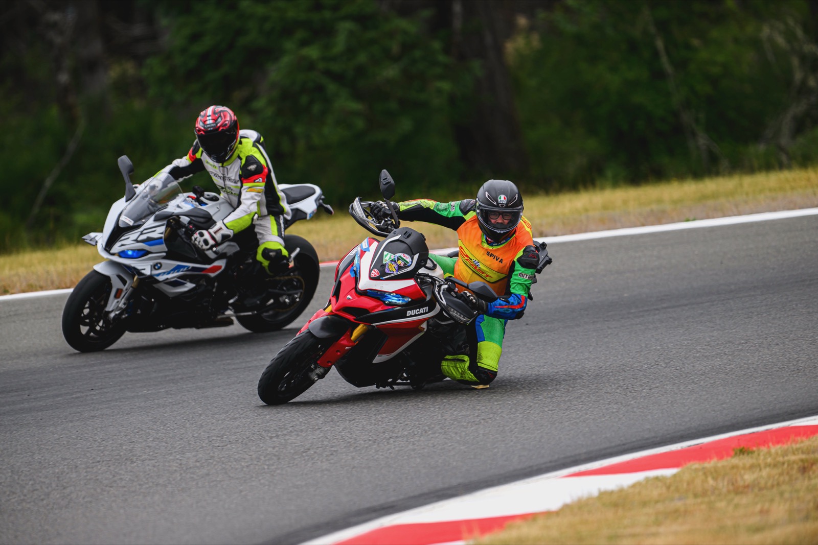 Jonathan pointing an apex from the Multistrada while leading a rider