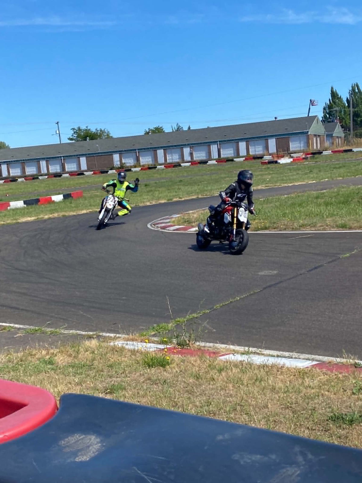 Jonathan following his niece on track at Mac Track and waving to the camera