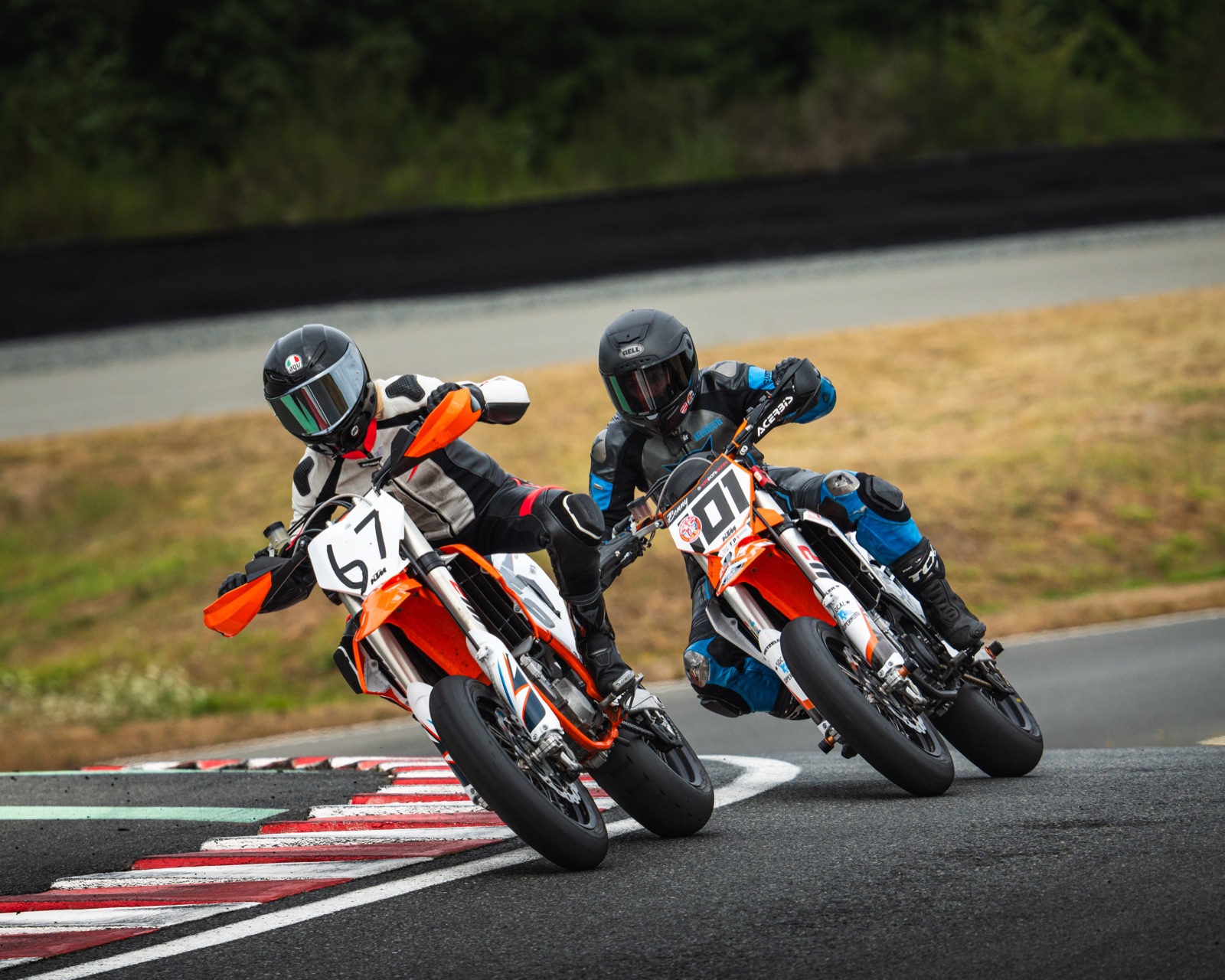 Madison Hayes riding the #67 Team Encompass KTM 450 SMR next to the #101 Spiva Racing KTM at Vancouver Island Motorsport Circuit (photo 15 of 64)