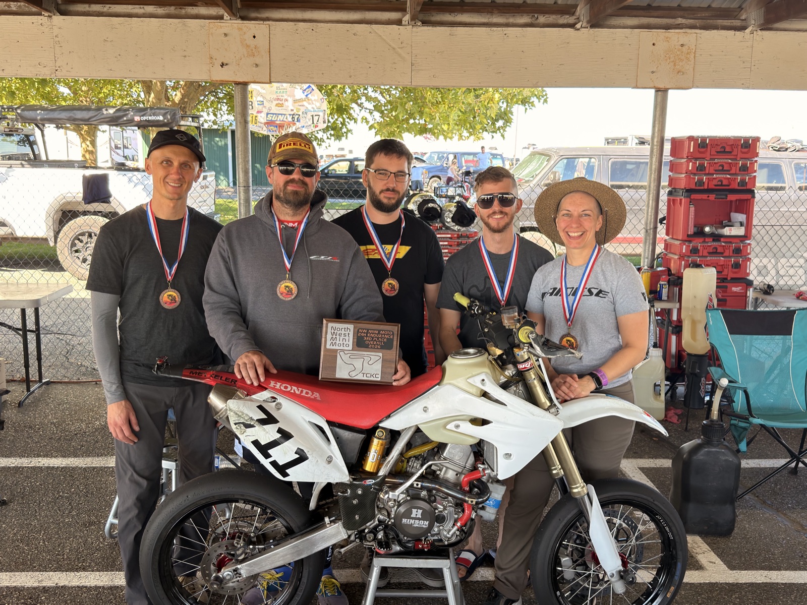 The Spiva Racing Team with their medals, the third place plaque and the Honda CRF150R #711 at TCKC (photo 1 of 1)